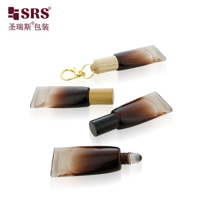 kopen Groothandel Lichtbestendige Bruine Gradiënt Coating Gekleurde Glazen Fles Container Met Steen Roller Bal Voor Parfum Met Sleutelhanger 10ml online vervaardiging